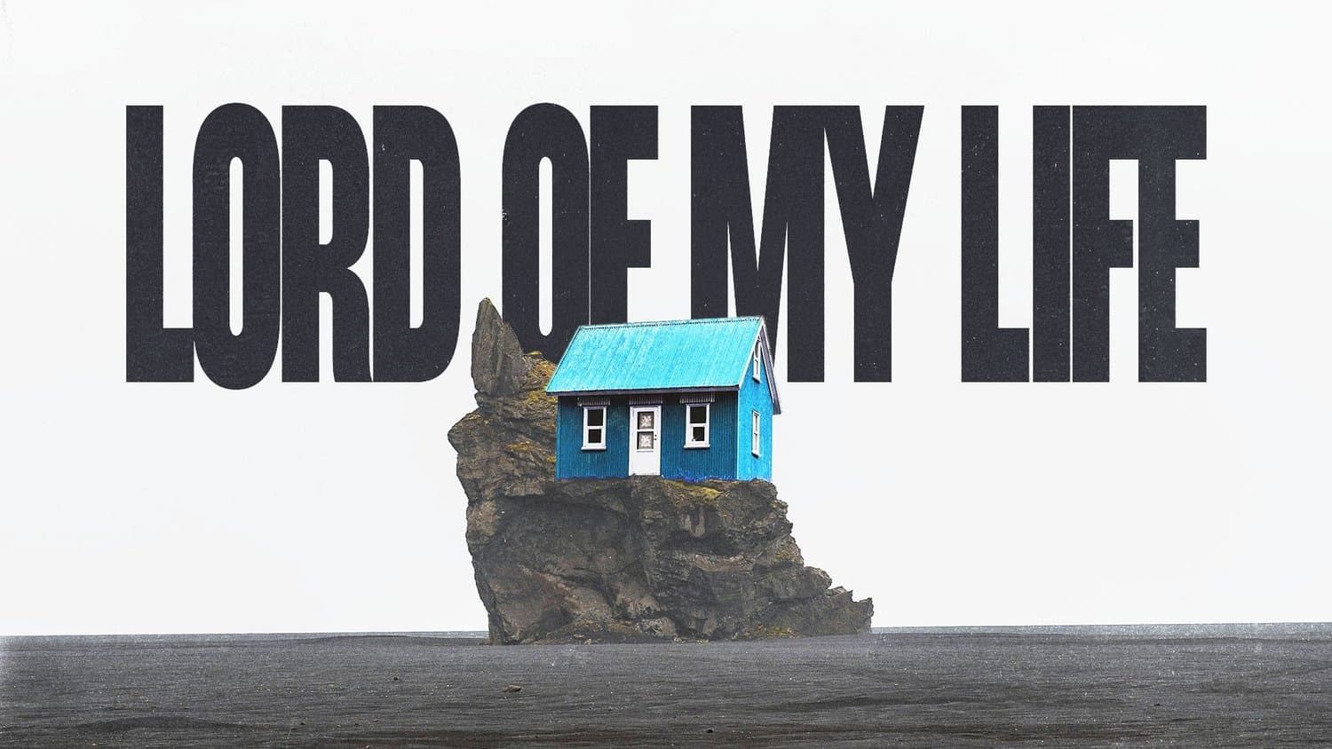 A white sermon title slide reading LORD OF MY LIFE in black condensed capitals behind a photograph of a small blue house perched on a rock outcrop.