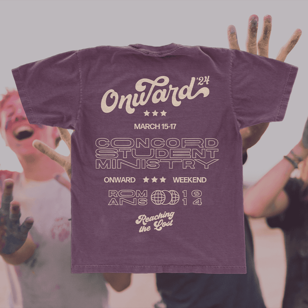 A merch mockup of a plum tee behind students covered in colour powder, printed Onward '24 in cream script with MARCH 15-17, CONCORD STUDENT MINISTRY and Reaching the Lost.