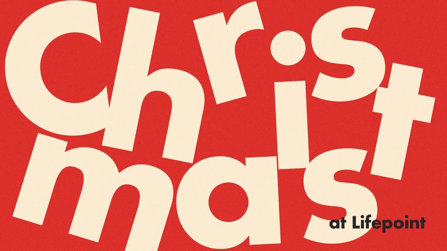 A Christmas title slide reading CHRISTMAS in oversized cream sans capitals tumbling across a flat red field, with at Lifepoint in black beneath.