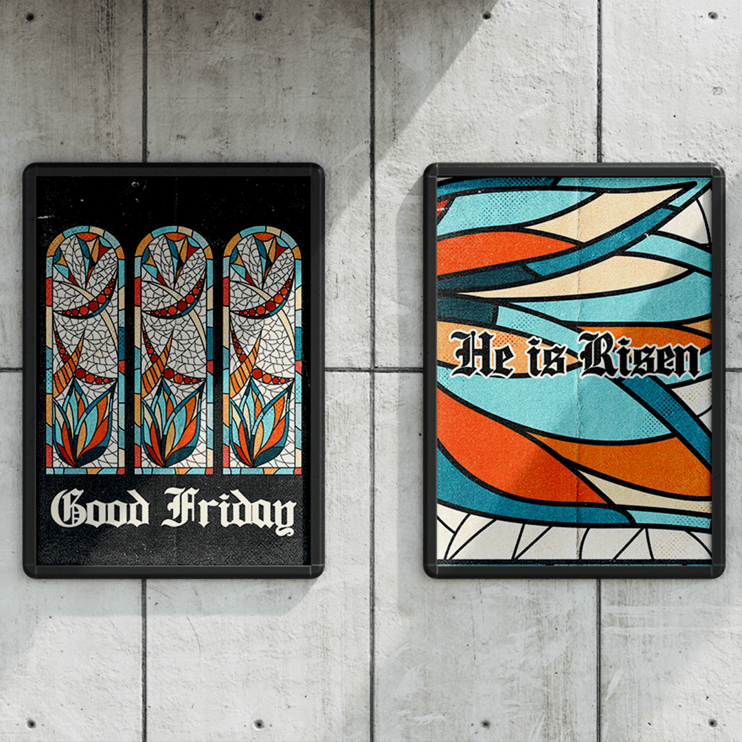 Two framed Easter posters on a concrete wall, a black one reading Good Friday under three stained glass arch windows, and a teal and orange one reading He is Risen in blackletter.