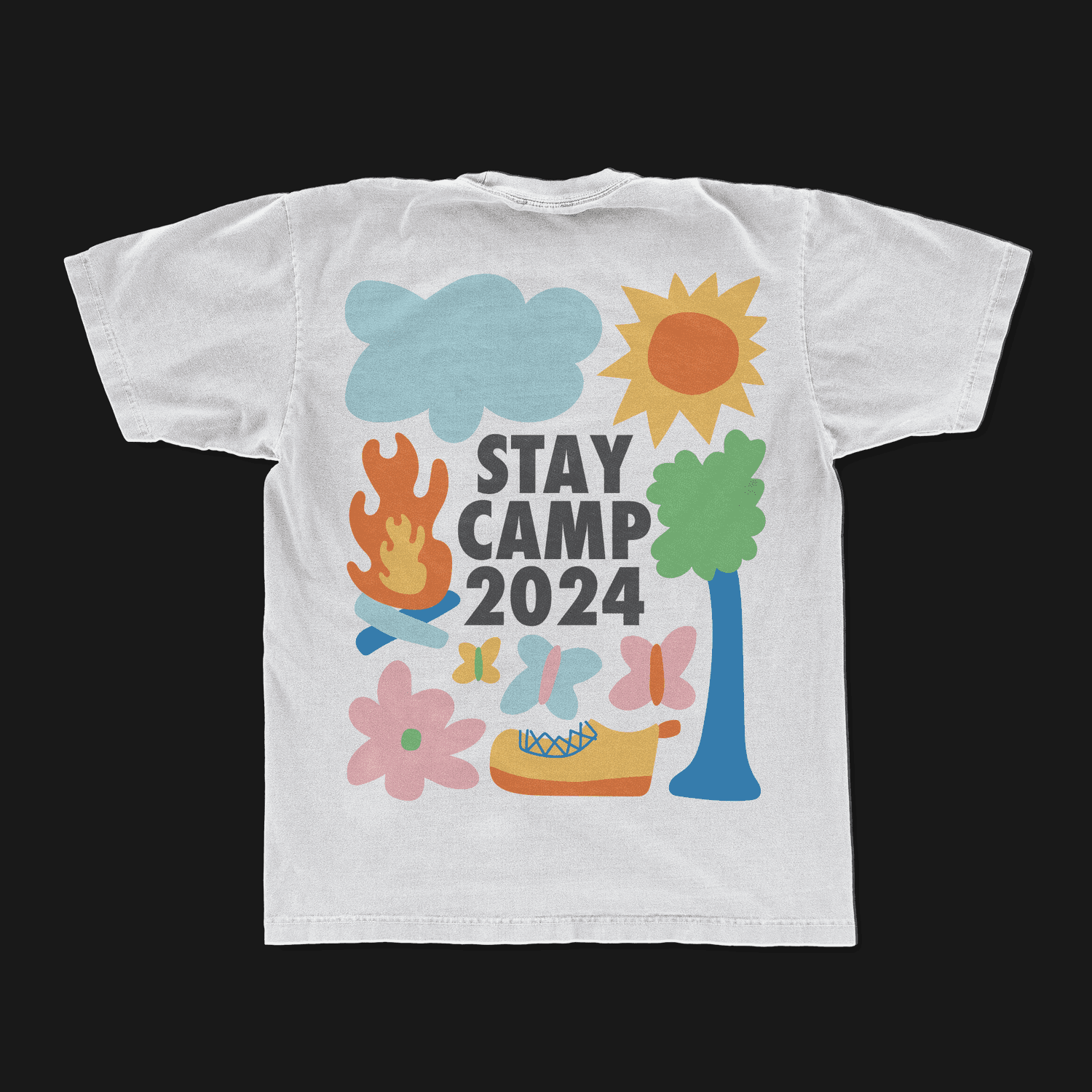A merch mockup of a white tee printed STAY CAMP 2024 in grey block capitals surrounded by flat illustrated shapes, a cloud, sun, campfire, tree, butterflies, flower and sneaker.