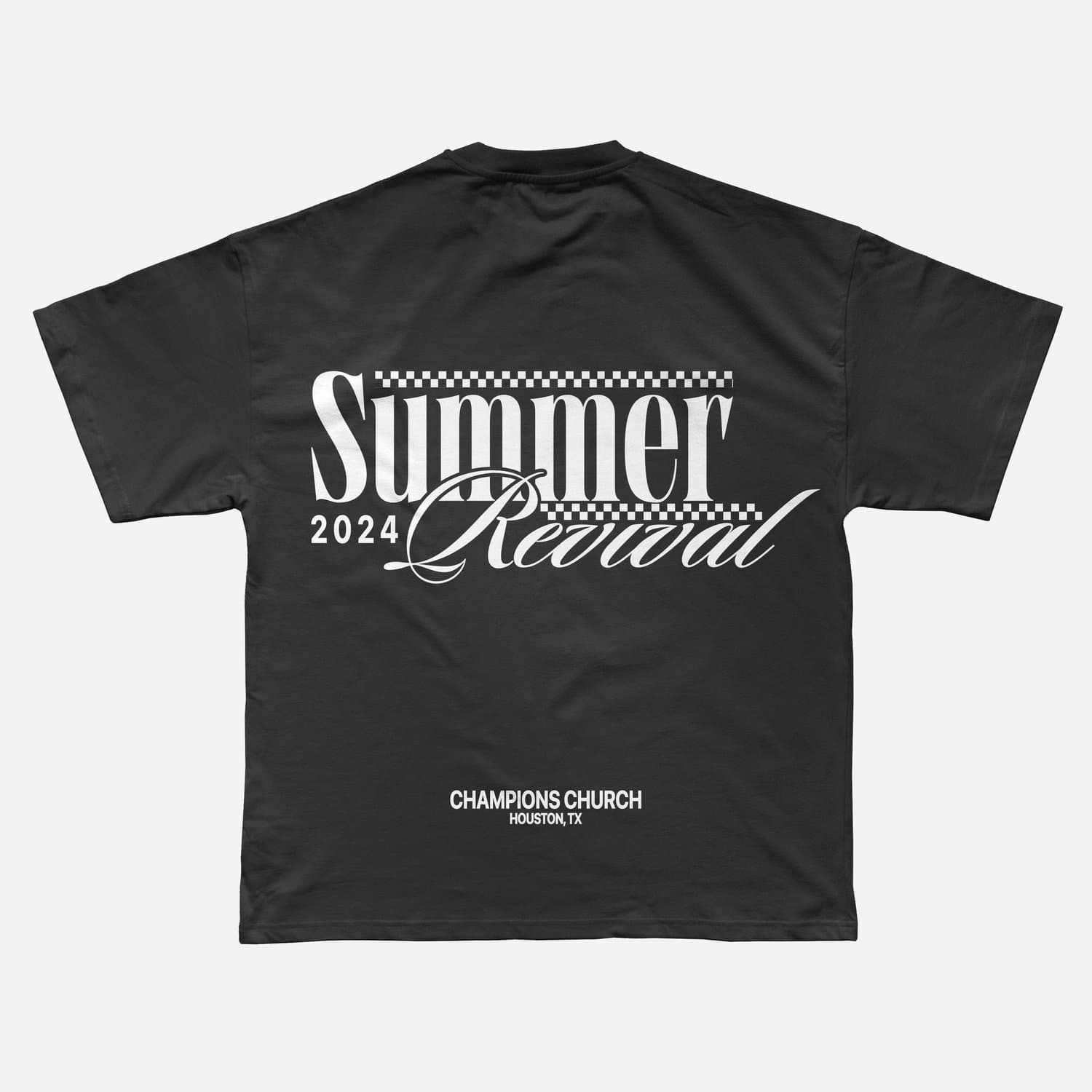 A merch mockup of a black oversized tee printed Summer Revival in white serif and script with checkerboard bands, dated 2024 above CHAMPIONS CHURCH HOUSTON, TX.