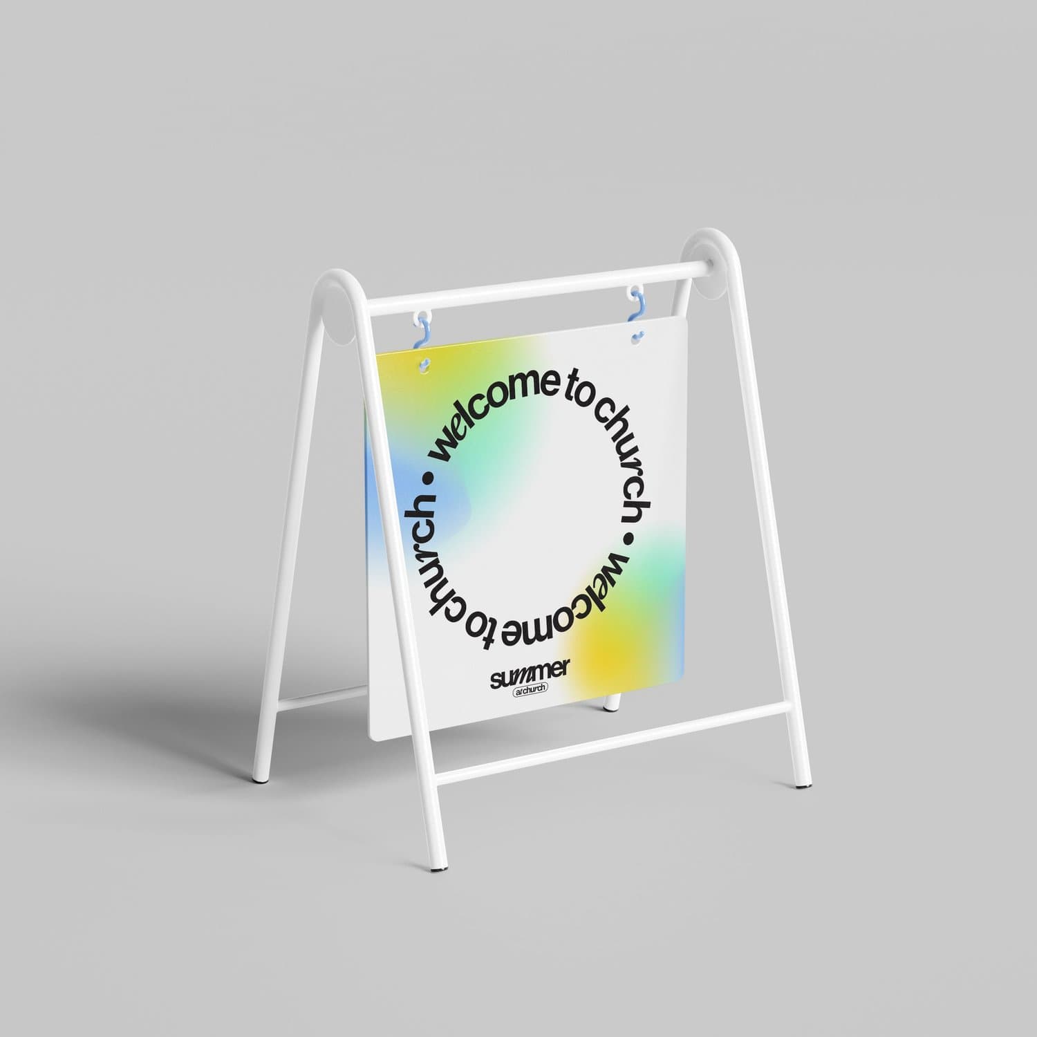 A white A frame sidewalk sign mockup with welcome to church set in a ring of black type around a blue, green and yellow gradient blur, marked summer at church at the base.