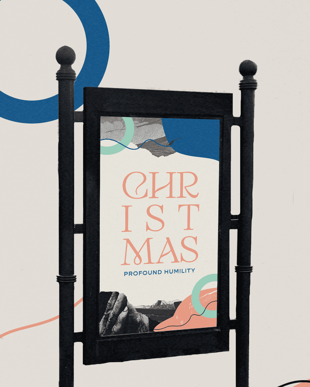 A product mockup of a poster reading CHRISTMAS PROFOUND HUMILITY in coral and blue serif, displayed in a black metal freestanding sign frame against a cream background.